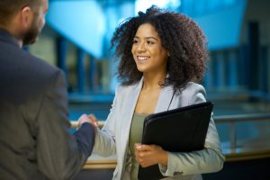 job applicant shaking hands .